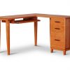 Corner Desk in cherry with drawer pedestal on right containing two drawers and one file cabinet, keyboard shelf on left