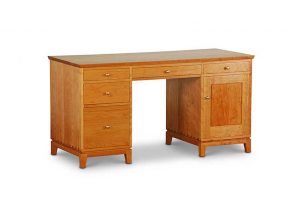 Double Pedestal Desk in Cherry with two drawers and file cabinet on left, center drawer, one drawer and cabinet with door on right, all with brass knobs