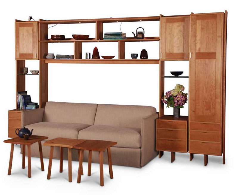 Wall unit in cherry with lower drawers, upper cabinets and open shelving in the upper center space, open space below contains sofabed sold separately